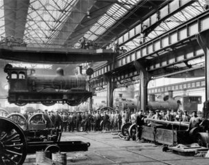Suspended locomotive  North Eastern Railway's Gateshead Works  c 1910.