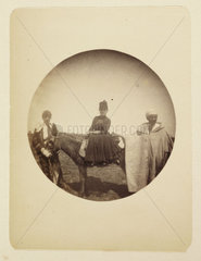 Woman riding a donkey  c 1890.