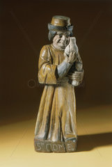 Wooden statue of St Cosmas  probably French  19th century.