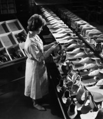 Female worker inspects Norvic Shoes  Norwich  1961.