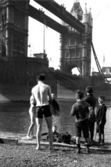 Boys by the River Thames at Tower Bridge  London  c 1910s.