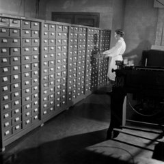 Librarian with library of computer card files  English Electric  1954.