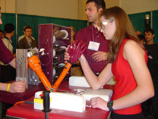 Student wrestling with a robotic arm  8 March 2005.