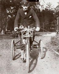 C S Rolls sitting on a de Dion tricycle  Cambridge  1897.