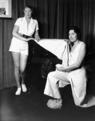 Women posing with the latest HMV gramophone  31 January 1933.