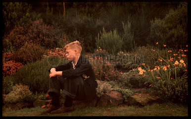 Boy in a garden  c 1940.