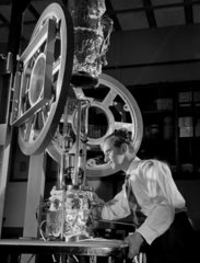 An engineer with a magnetic thin film deposition  Mullard Research Labs.
