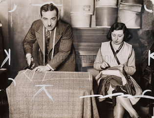 A tailor and his assistant at work  March 1930.