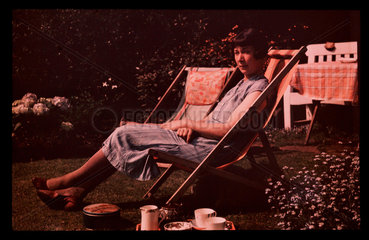Woman in a deckchair  c 1935.