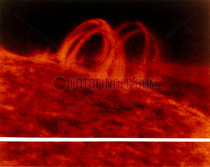 Post-flare loop above the Sun’s surface  ultraviolet photograph from Skylab  1973.