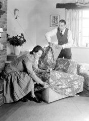 Couple fitting armchair covers  1949.