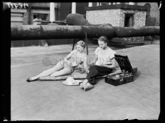 Two women sunbathing  1932.