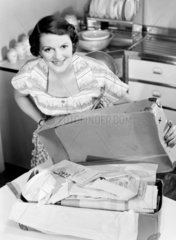 Woman with a box of laundry  1950.