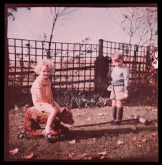 Children playing in a garden.