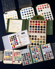 Sample cards of coloured casein plastic buttons  c 1950s.