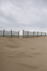 Warnemuende  Zaun am Strand