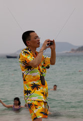 Sanya  Tourist am Strand