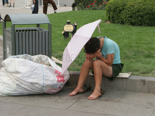 Obdachlose Frau in Beijing.
