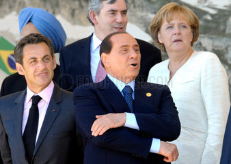 Sarkozy + Singh + Brown + Berlusconi + Merkel