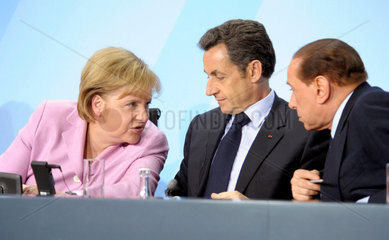 Merkel + Sarkozy + Berlusconi