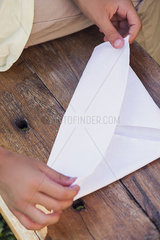 Child folding paper  cropped
