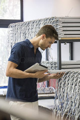 Man inspecting products in factory