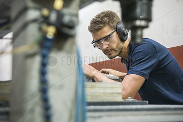 Machinist working in factory