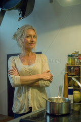 Mature woman cooking at home  portrait
