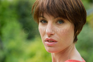 Woman looking over shoulder  portrait