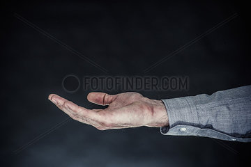 Man's extended hand  palm facing up