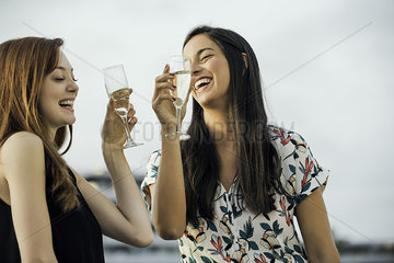 Women drinking champagne outdoors