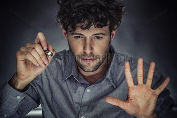 Man using stylus and transparent touch screen