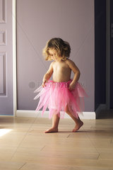Little girl wearing pink tutu