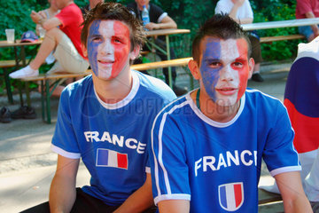 Germany. Berlin - France football fan at a streetparty