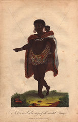 A woman of Terra del Fuego  South America  carrying a baby on her back.