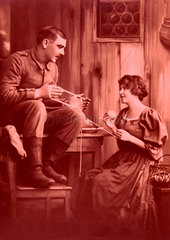1900  Paar beim Aufrollen von Garn