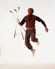 Golfspieler springt