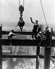 Laying a beam  Empire State Building  New York  c 1931.
