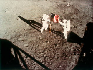 Astronauts Armstrong and Aldrin unfurling the US flag on the Moon  1969.