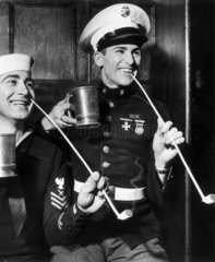American sailors smoking clay pipes and drinking from tankards  1942.