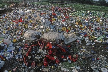 Plastic containers dumped in an open landfill site UK