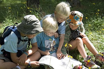 Children reading a map Queyras Alps France