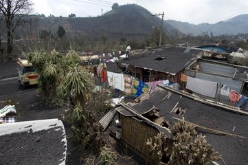 Devastated roofs by eruption of Pacaya volcano in Guatemala