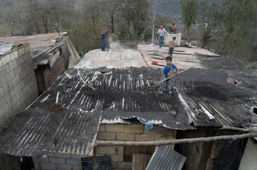 Devastated roofs by eruption of Pacaya volcano in Guatemala