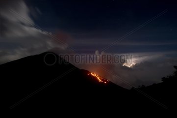 Lava rivers and storm on the Pacaya volcano in Guatemala
