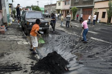 Street cleaning after eruption of Pacaya volcano Guatemala