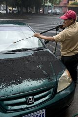 Car wash after eruption of Pacaya volcano in Guatemala