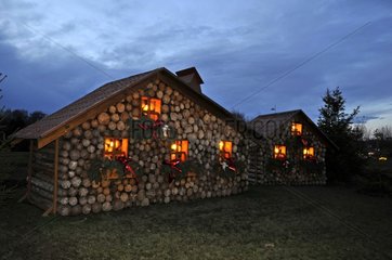 Cottages in wood logs on a roundabout Montbéliard France