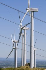 High tension lines crossing the Névian windmill farm France
