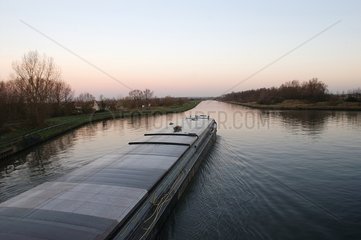 Barge on the channel of Neufossé at daybreak Arch